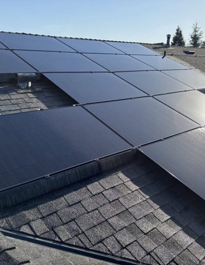 Streak-free residential solar panel system on shingle roof after maintenance service by Superior Solar Cleaners in the Central Valley.